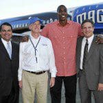 AirTran1 Orlando Magic Chief Operating Officer Alex Martins, AirTran Airways Sr. Vice President of Marketing and Planning Kevin Healy, Orlando Magic center Dwight Howard and AirTran Airways Chairman, CEO and President Bob Fornaro pose in front of the newest member of AirTran Airways' fleet, 'Magic 1.'