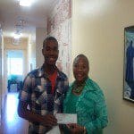 XReprsentative Thompson pictured with student Devinn Heard