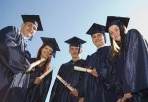 Five graduates. Shot from a low angle.