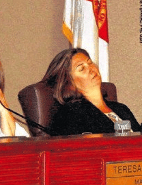 Orange County Commissioner Jennifer Thompson takes a nap at County Commission board meeting.