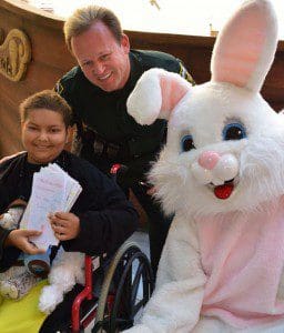 Reserve Sheriff's Deputy Dan Newlin poses with a patient and The Easter Bunny, at the Arnold Palmer Hospital for Children, March 30, 2013. (Photo credit: Frank J. Hahnel, III)