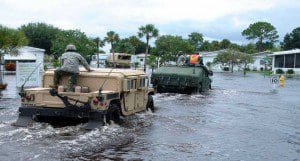 Members of the Florida National Guard's Delta Company, 1st Battalion, 124th Infantry Regiment, enter the Lamplighter Village mobile home park in Melbourne, Fla., to evacuate residents who request it, Aug. 21, 2008. Several residents were transported out of the park over the course of the day. Photo by Capt. David Ross, Florida National Guard Public Affairs.