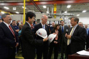 Florida Governor Rick Scott (center) is presented with ceremonial hard hats by Mitsubishi Power Systems Americas, Inc. executives following his tour of the company's Orlando manufacturing center. Joining him on the plant tour are (left-to-right) Bob Provitola, MPSA's Orlando facility's General Manager, Koji Hasegawa, Mitsubishi Power Systems Americas president and CEO, (Governor Scott) and Dave Walsh MPSA's senior vice president. (PRNewsFoto/Mitsubishi Power Systems Americas, Inc.)