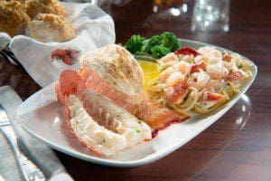 Lobster Lover's Dream: A succulent rock lobster tail and sweet split Maine lobster tail, roasted and served with lobster and shrimp linguini Alfredo. (PRNewsFoto/Red Lobster)