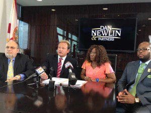 l-r: Attorney Dutch Anderson, Dan Newlin, Alma Fletcher and attorney Jarian Lyons at press conference during which the civil lawsuit filed by Dan Newlin & Partners was announced, July 31, 2013. (Photo: WONO)