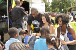 Magic Dancers along with Magic Community Ambassador Nick Anderson helps hand out backpacks to youth from Parramore Kidz Zone as part of the Magic’s Back to School Celebration on Weds., Aug. 7 at the Callahan Center. The Magic teamed with Dixon Ticonderoga and Amway to provide backpacks filled with school supplies to help prepare the students for the upcoming school year. (Photo: Orlando Magic)