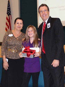 Chole Pinkston proudly displays her winning prize