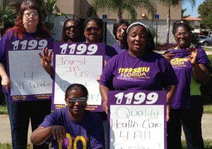 Consulate caregivers team up with 1199 SEUI members, picketing for a living wage, affordable health insurance and improved work conditions at the