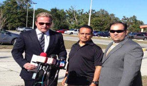 l-r: Attorney Dan Newlin Fransico Gonzales and attorney David Davila of Dan Newlin & Partners at a press conference at Iglesia la casa del afero Porter House Church, 7051 Pershing Avenue, Orlando, December 13, 2013. (Photo: WONO)