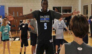 Magic guard Victor Oladipo spends time coaching and visiting with youth during the Magic Kids’ Hoops Clinic.  The children took part in a clinic with the entire team including Magic players and coaches. Photo credit: Gary Bassing.