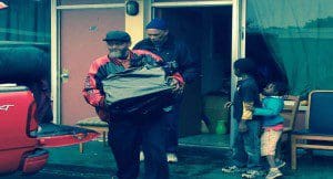 Residents of Eatonville Home Town Suites pack up to leave on January 31, 2014. (Photo: WONO)