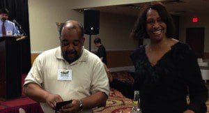 Derrick Wallace, candidate for Orange County Commission, District 6, shares a joke with Patricia Rumph, candidate for District 2, at the Pine Hills Business Association event, Soiree Event & Conference Center, February 18, 2014. (Photo: WONO)