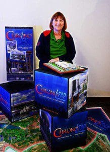 Lori Walters displays a model of the General Motors Pavilion from the 1964/65 New York World's Fair. While most of the pavilions, including GM, were torn down after the Fair ended, Walters will be working with a group of middle school students this summer to scan and record the details of New York Pavilion, which still stands. (Photo: UCF)