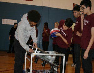 Robotics team members in action: from left Michael Anderson(Hunter's Creek,12th grade) Carlos Barea(Hunter's Creek,10th grade),(Sebastian Gonzalez(Ocoee,10th grade)and Dennis Berrios (Hunter's Creek-Falcon's Trace,8th grade).