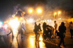People in Ferguson, Missouri protest the grand jury's decision not to indict police officer Darren Wilson in the shooting death of unarmed teen, Michael Brown, November 25, 2014.. (Photo courtesy: alfahir.hu)
